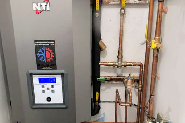 Prestige technician performing a furnace replacement for a homeowner in Beacon NY